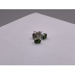 A pair of chrome diopside studs in silver.