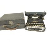A Corona Folding Typewriter with Case. Case is wor