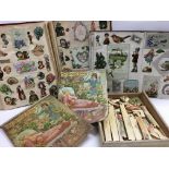 Two Victorian scrap albums containing various images including Christmas, flowers, people and