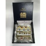 A boxed Royal Crown Derby paperweight 'Mulberry Hall Shop' 307/500.