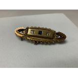 An Edwardian 15ct gold diamond and blue stone bar brooch.