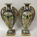 A pair of hand decorated Noritake porcelain vases, condition issues.