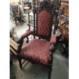 A quality Victorian carved oak open arm chair with barley twist supports. Height 132cm