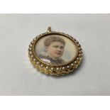 A 9ct gold cased and double sided miniature portrait pendant.