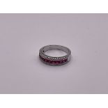 An 18ct white gold ruby and diamond ring.