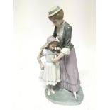 A Lladro figure of a mother and child no damage he