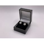 A pair of 9ct gold diamond cluster stud earrings,