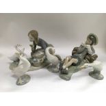Five Lladro figures of children and geese.