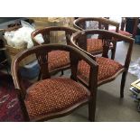 A set of six Edwardian inlaid mahogany tub chairs with patterned fabric on square legs. Very good