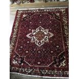 A Persian style rug, approx 176cm x 200cm.