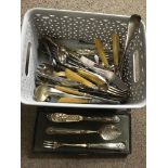 A small silver serving spoon, together with two cased cutlery sets and a small quantity of cutlery
