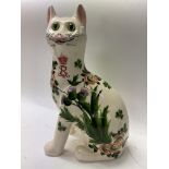 A Wemyss Giselda pottery cat with floral decoratio