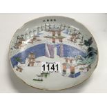 A Chinese Republic saucer decorated with pagodas.