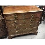 A George III mahogany chest of drawers fitted with a brushing slide above four graduating drawers on