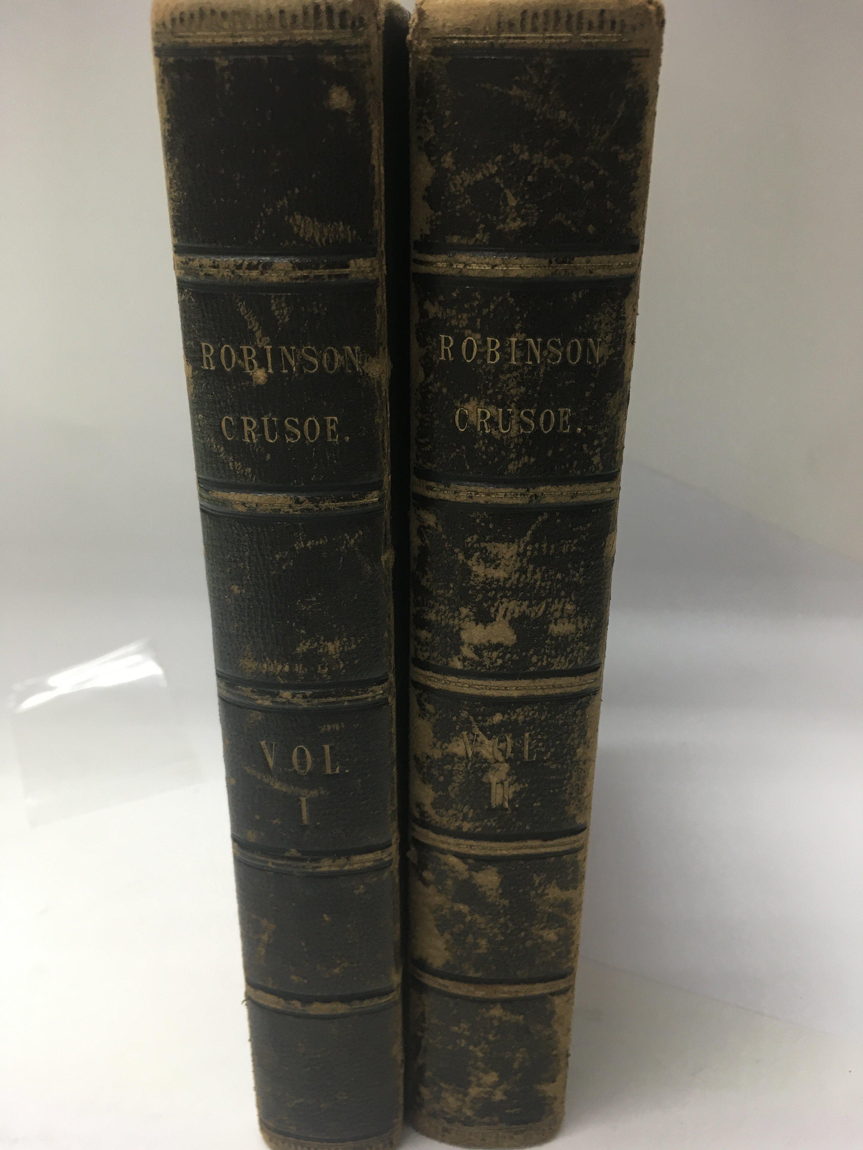 Two volumes Life adventures of Robinson Crusoe dated 1804 .