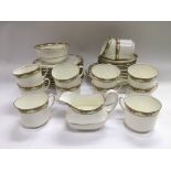 An Aynsley tea set with a band of floral decoration on a white ground.