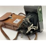 A vintage leather cased Kodak Six-20 camera.