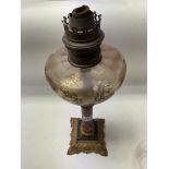 A Victorian Brennan Oil lamp with polished stone central column. 43cm.