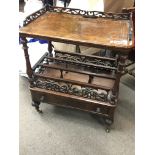 A Victorian inlaid walnut Canterbury for restoration with turned supports above a single drawer.