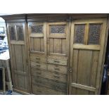 A quality late Victorian carved oak compactum wardrobe with matching dressing table. With quality