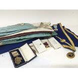A collection of Masonic regalia including a silver gilt Dickens lodge enamel jewel other jewels