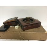 An antique mahogany and brass quarter plate camera with extra plates and a box of wooden plate