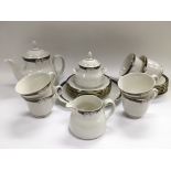 A Royal Doulton six place setting tea service in Enchantment pattern.