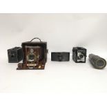 Four cameras: Kodak Brownie, Purma Special, Wizard