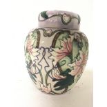 A Moorcroft jar a d cover tube line decorated with