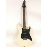 An unbranded electric guitar in Stratocaster shape