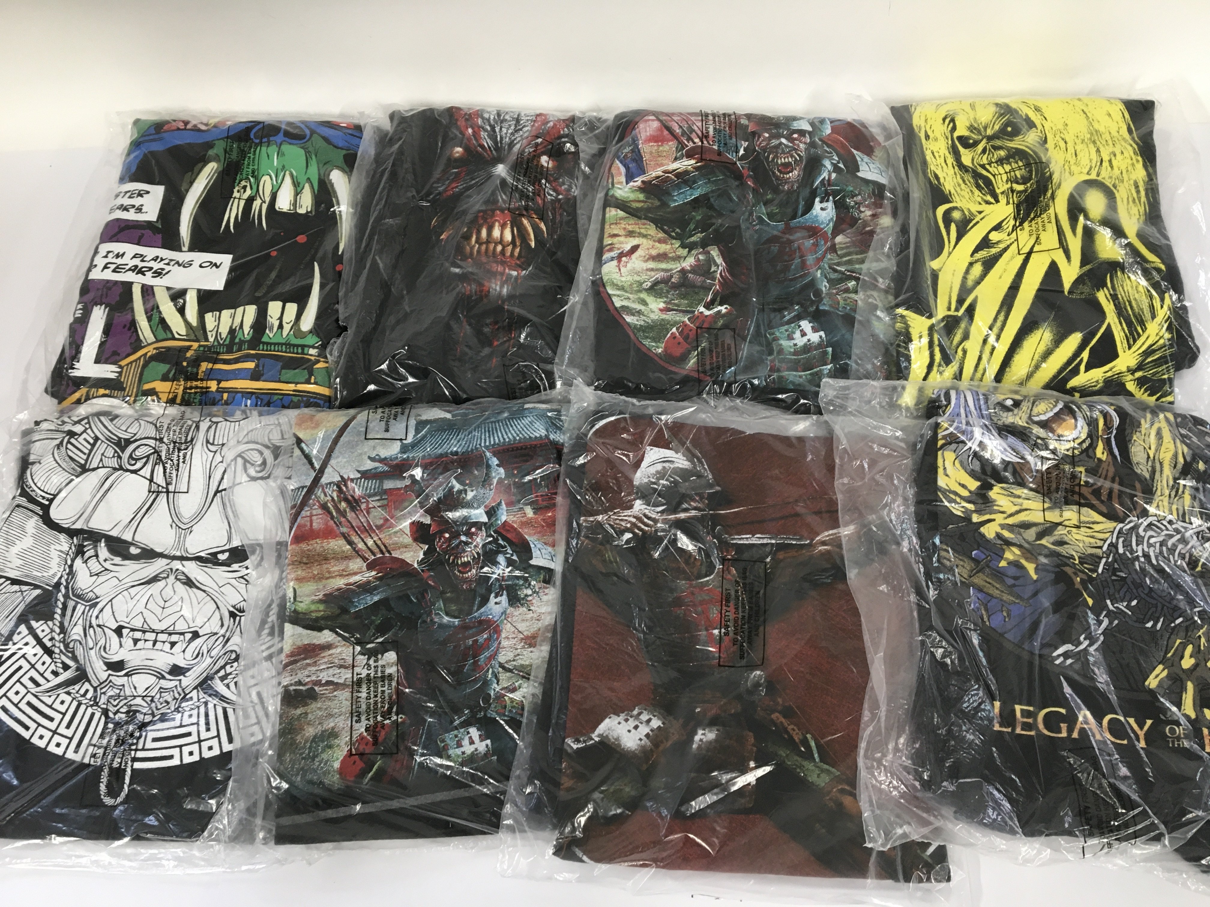 A box of Iron Maiden t shirts, XL sizes.