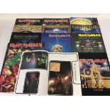 A collection of Iron Maiden tour programs includin