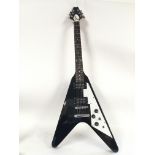 A Stagg Flying V shaped electric guitar with Gibso