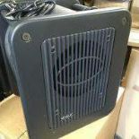 A boxed Genelec 7050B active subwoofer.