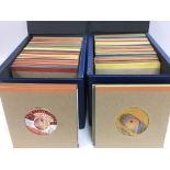 Four record cases of 7inch singles by various rock