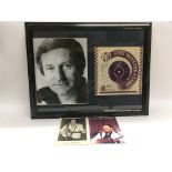 A signed Lonnie Donegan 7inch single framed with a