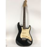 A Stratocaster electric guitar with Fender and Eri