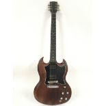 A 2003 Gibson SG electric guitar in a walnut finis