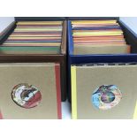 Four record cases of 7inch singles by various rock