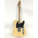 A Telecaster style electric guitar with a Fender d