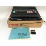 A boxed Yamaha RX5 digital rhythm programmer with