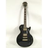 A replica Gibson Les Paul Custom electric guitar in black, with later modifications, serial number 0