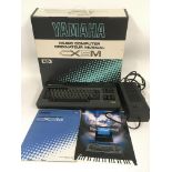 A boxed Yamaha CX5M music computer with original b