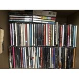 A box of CDs by various artists including Miles Da