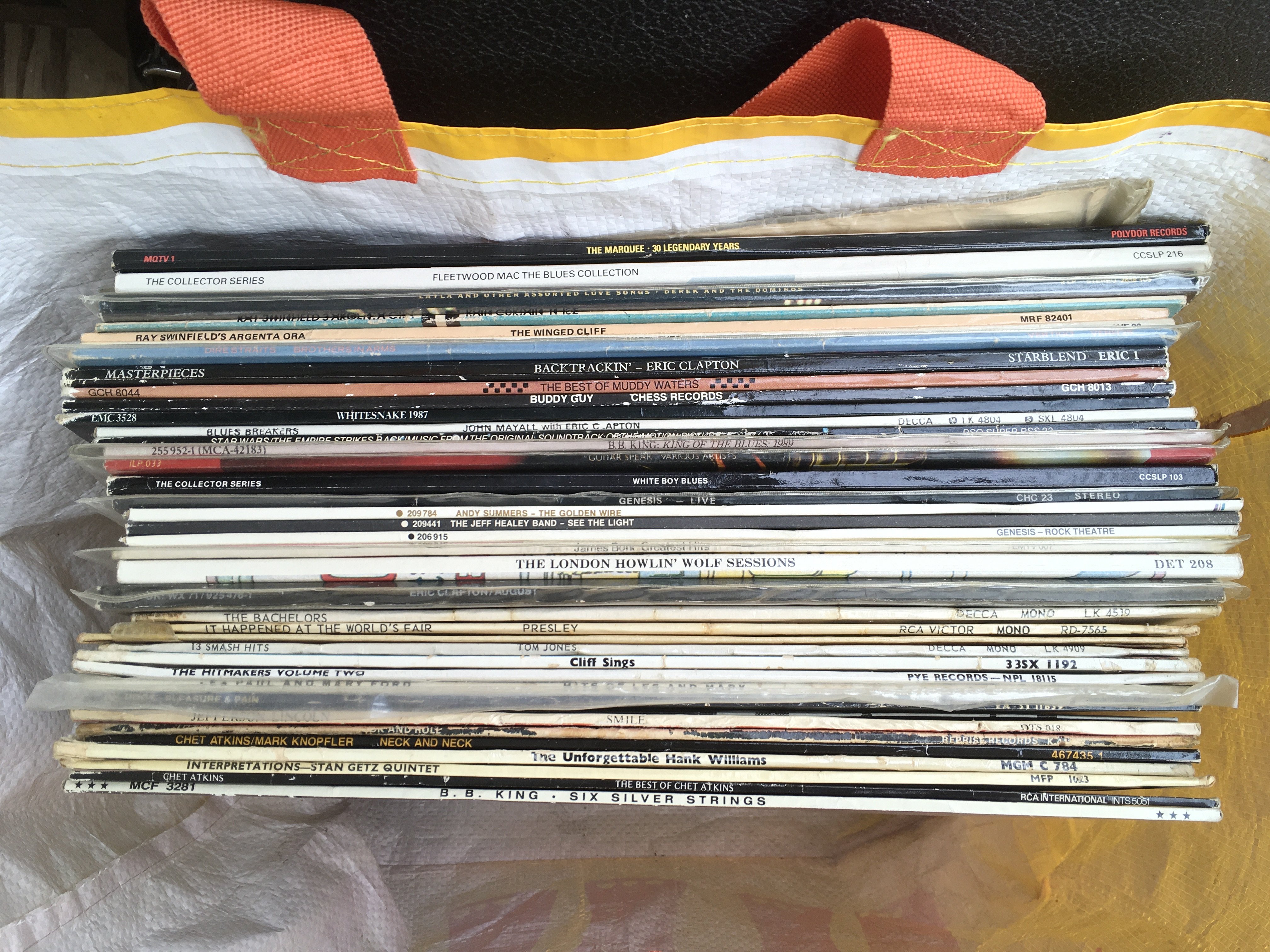 A collection of LPs by various artists including M