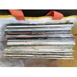 A collection of LPs by various artists including M