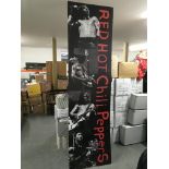 A large Red Hot Chili Peppers shop display board,