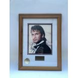 A framed and glazed signed photo of Patrick Swayze