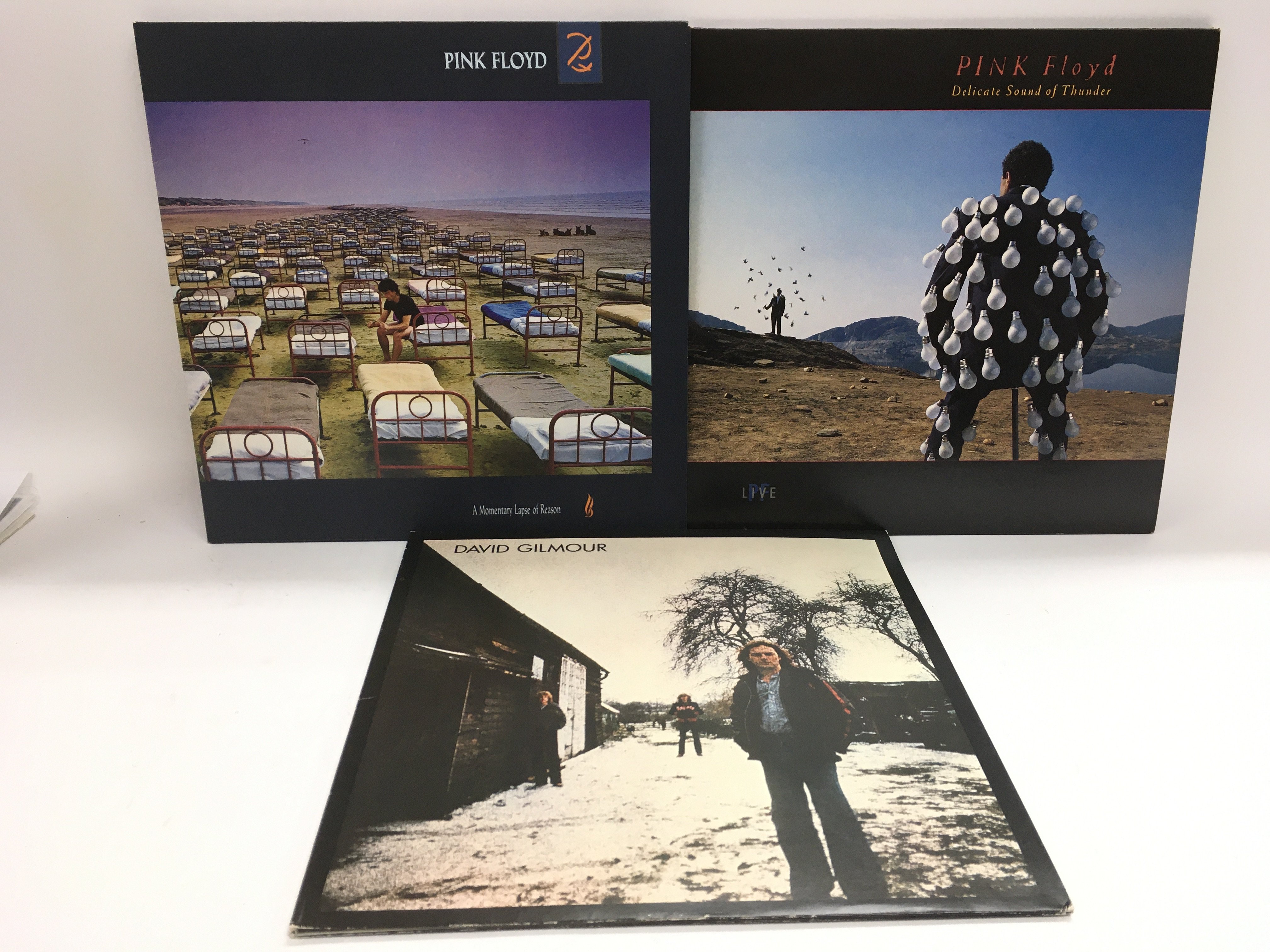 Three Pink Floyd and solo LPs comprising 'A Moment