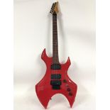 A Custom edition electric guitar in red with a cof